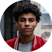 A young man in a red jacket